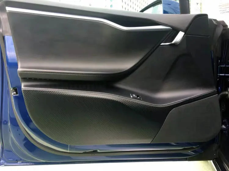 Tesla Model S door protective film package showing four transparent carbon fibre sheets for interior door panel protection