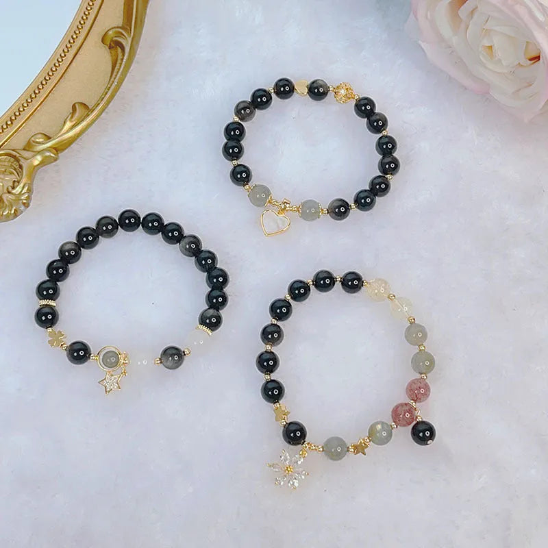 Silver stone bracelet for women with electroplated finish showing flower, love heart and star charm options