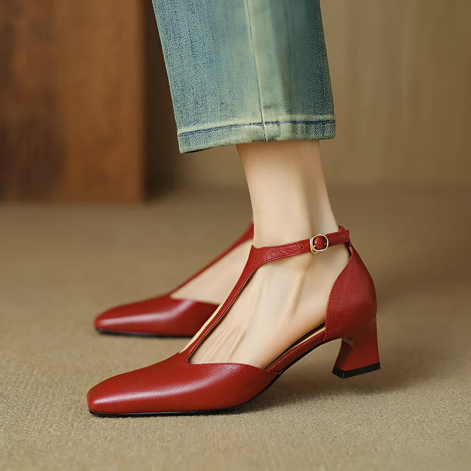 Wine red women's square toe chunky heel shoes made from sheepskin leather with a buckle strap.