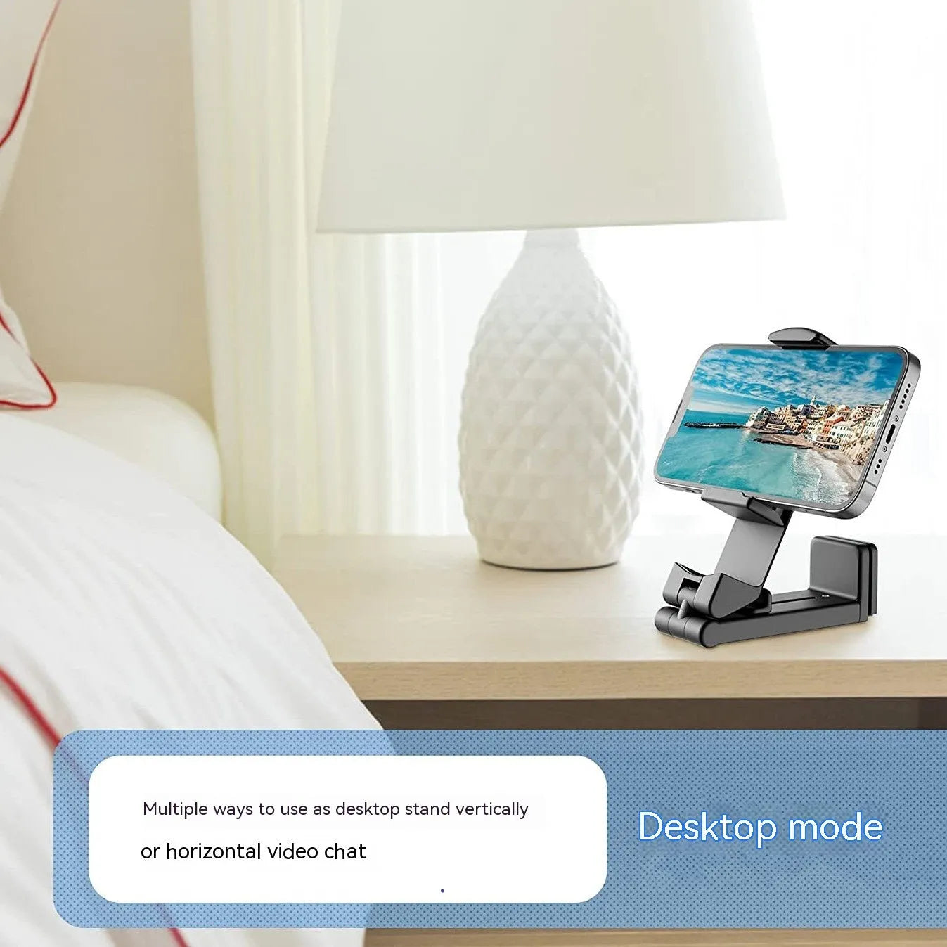 Universal foldable rotating phone holder in black, shown holding a smartphone in landscape orientation.