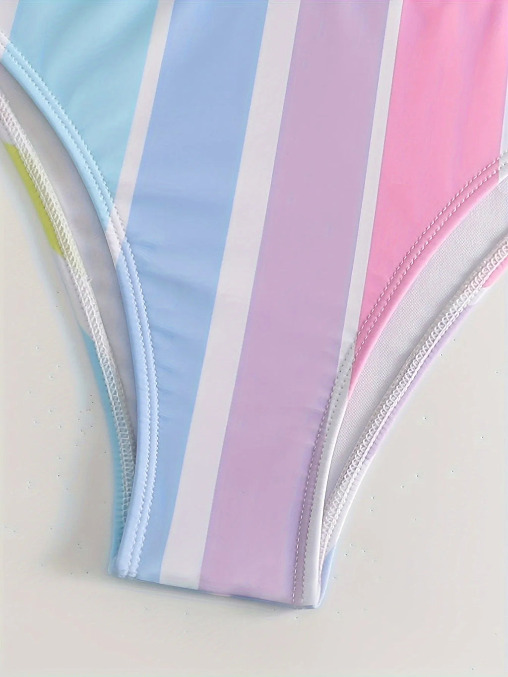 Women's striped bikini swimwear set with top and briefs for swimming sports.
