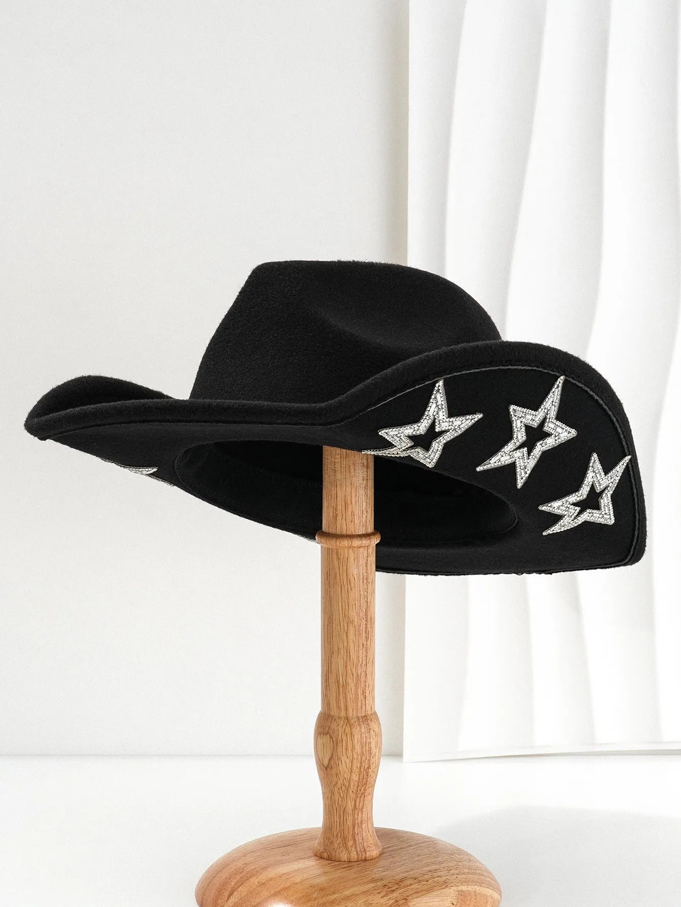 Beige polyester western denim top hat with a conical crown and a silver hexagonal star decoration on the front.