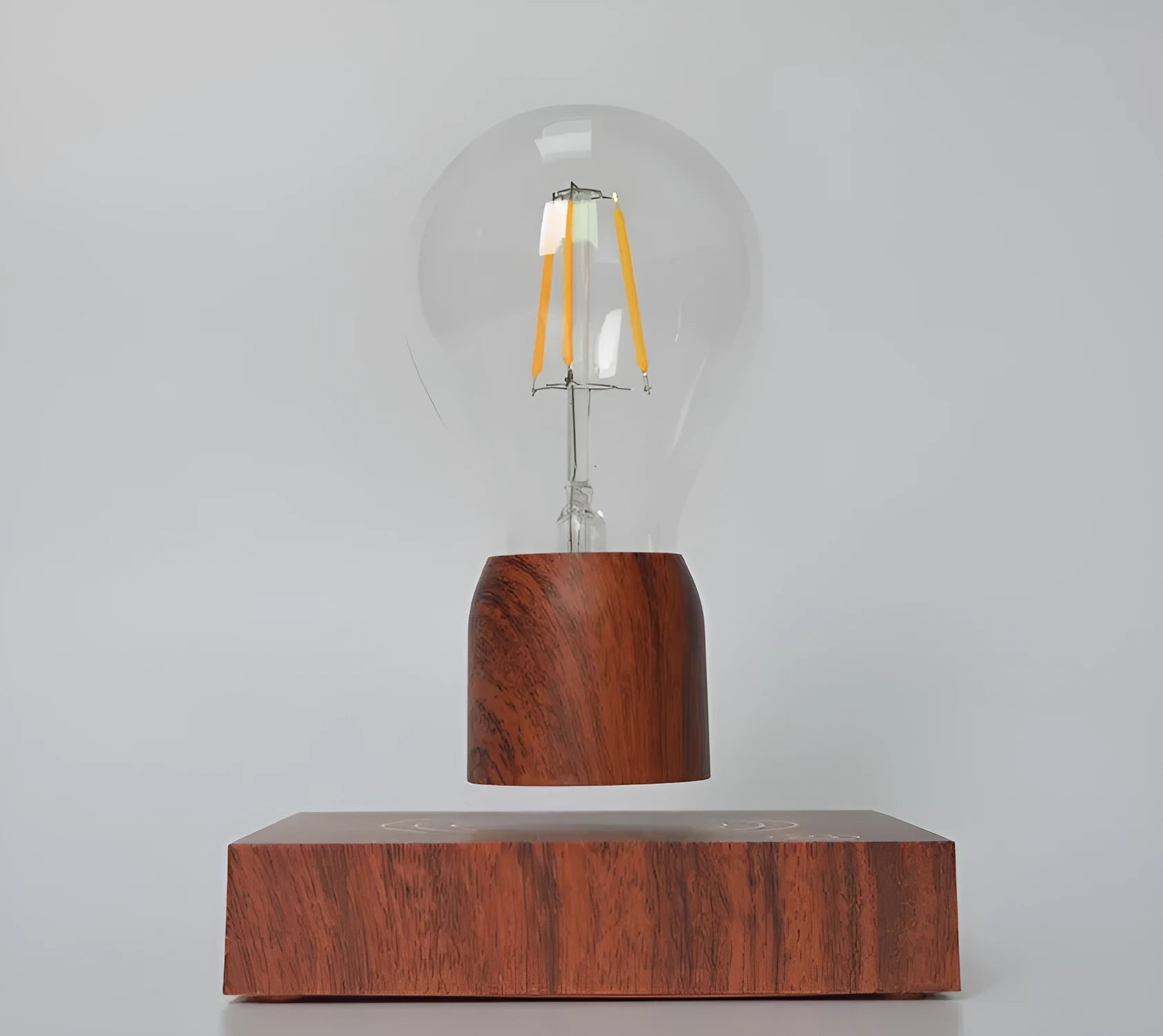 Magnetic levitation floating bulb lamp with imitation wood base and glass construction