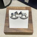 Diamond studded women's light luxury rocking horse drop earrings in gold colour on display