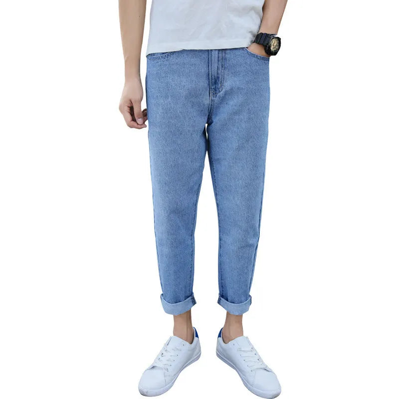 Men's black loose straight harem jeans with elasticated waistband and tapered leg opening