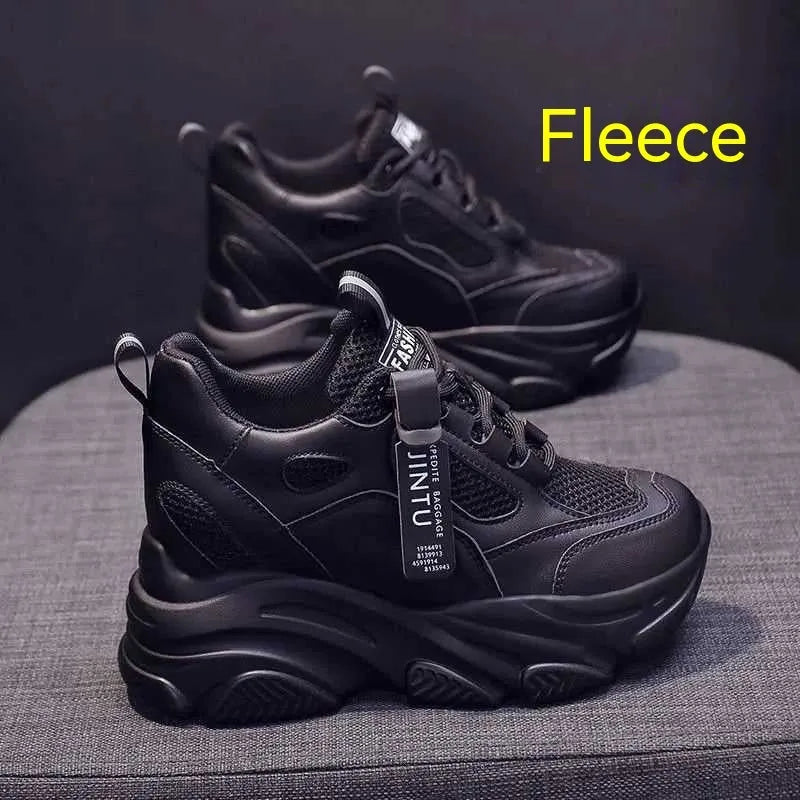 Men's black casual platform shoes with mesh upper and hollow out design on a white background.
