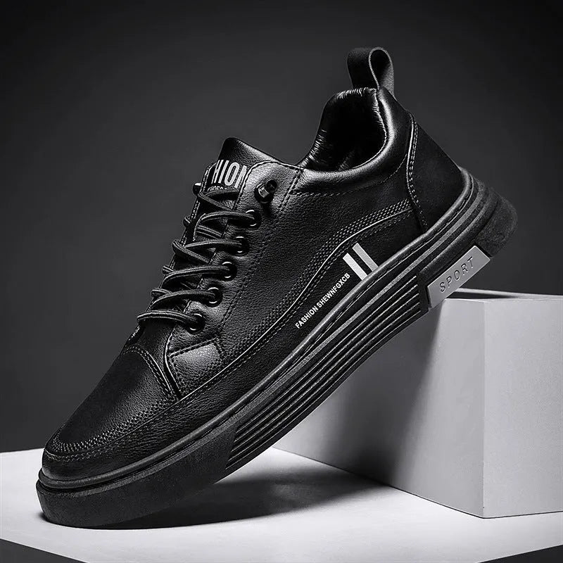 Men's white low-top skate shoes with elastic band and round toe, on a plain background.