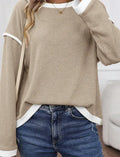 Women's loose knit top with drop shoulders and four leaf clover contrast trim in polyester fabric