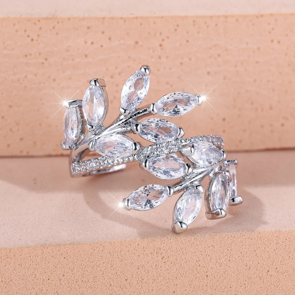 Adjustable copper leaf ring with zircon stones in multiple colour finishes including platinum white and rose gold