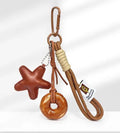 Handmade soda bread handbag pendant with brown star details and carrying strap