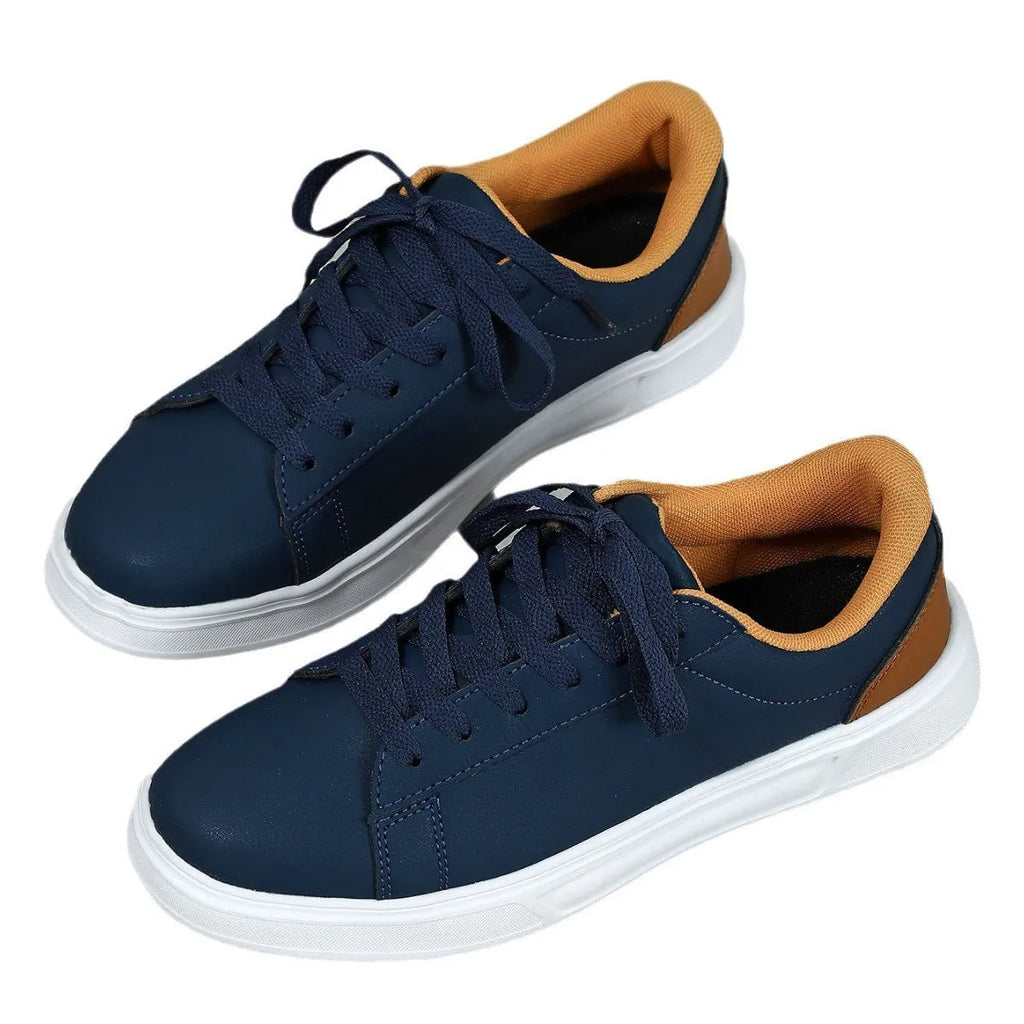 Casual beige brown platform sneakers with a cross strap and round toe on a flat rubber sole.