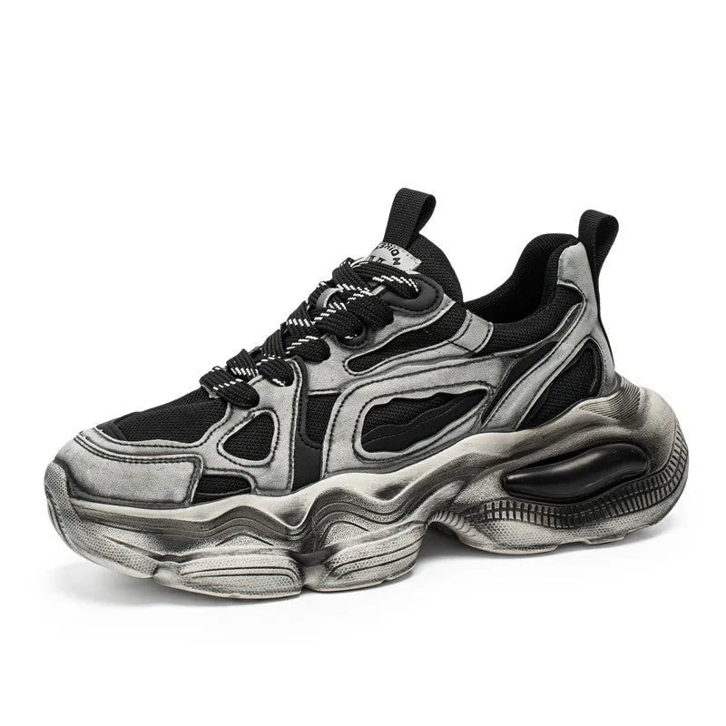 Men's black mesh sneakers with white rubber sole and platform heel on a plain background