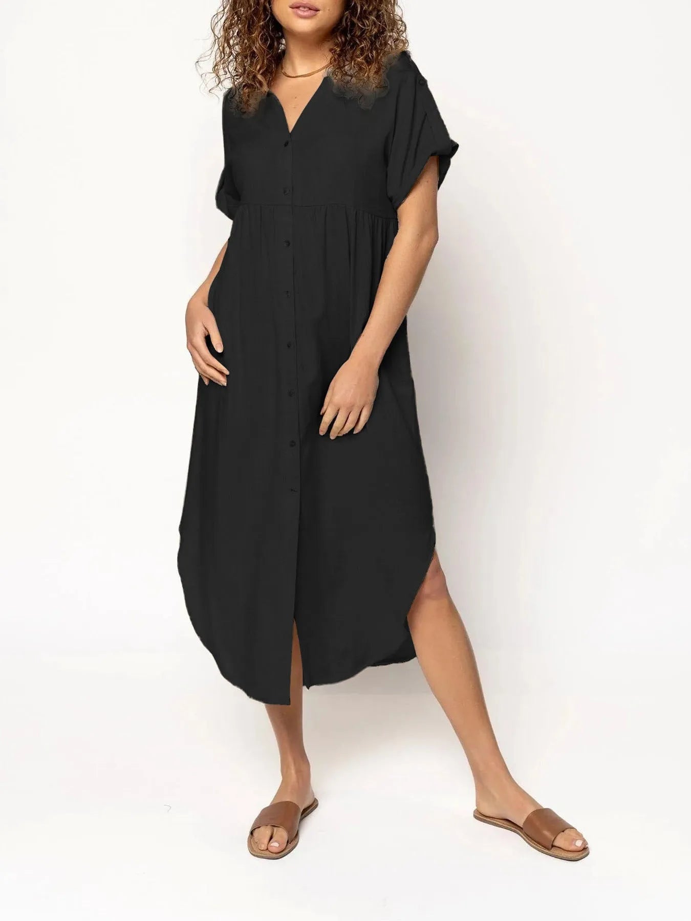 Loose-fitting casual solid colour button dress in a mid-length style on a hanger.