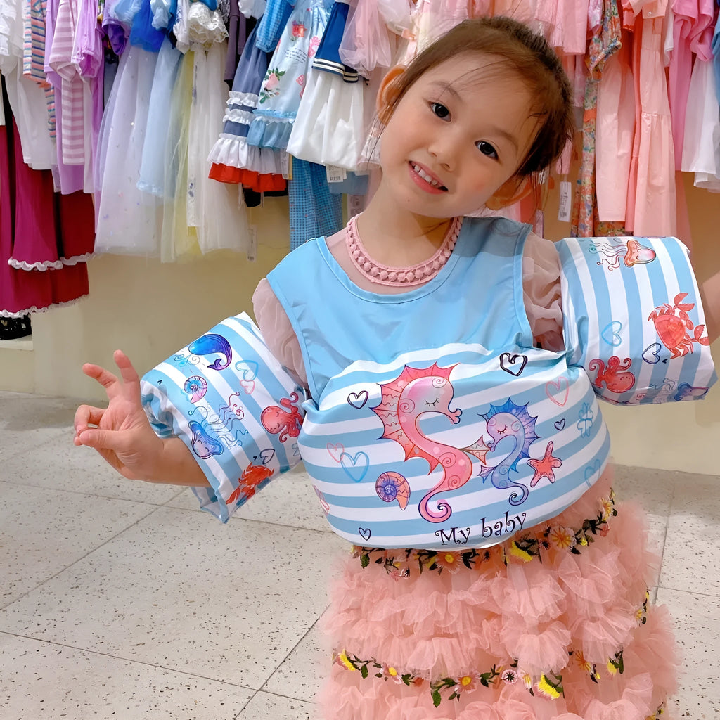 Colourful cartoon children's swimsuit with integrated arm swimming rings in a lobster design.