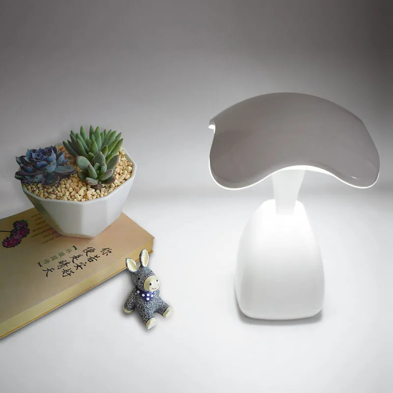 White modern LED desk lamp with a touch-sensitive base and plastic shade.