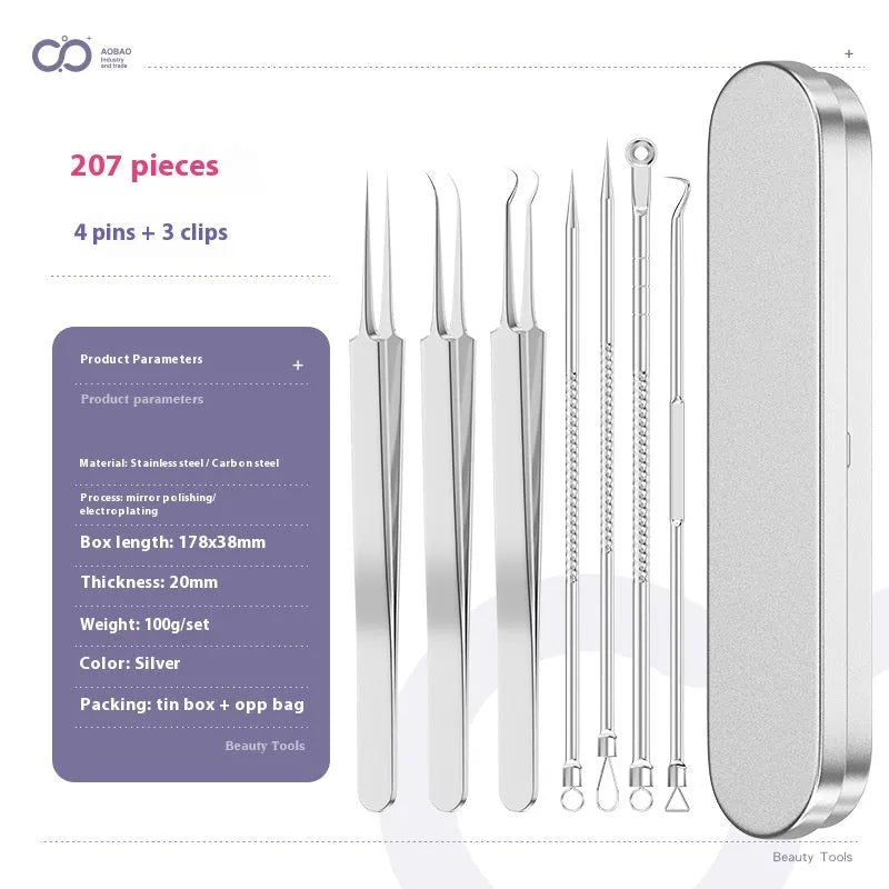 Four silver metal acne needles with fine pointed tips laid out on a flat surface.