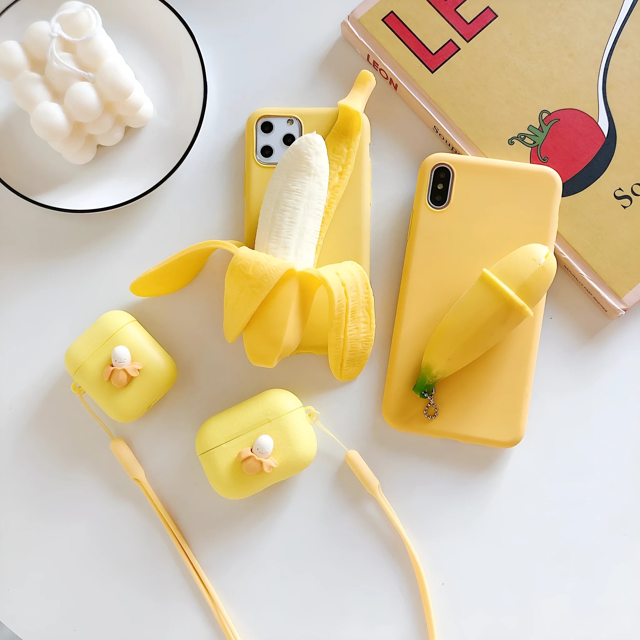 Creative Personality Squeeze The Banana design on a yellow hard back cover for an iPhone.