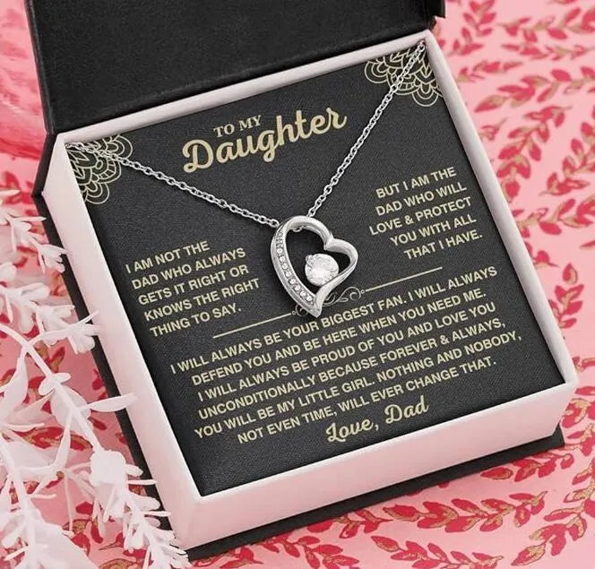 Hollow heart-shaped pendant necklace in gold or silver finish with gift box and card.