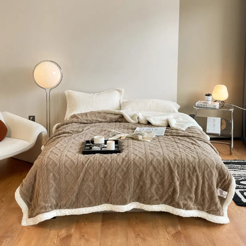 Polyester thermal flannel blanket in beige colour, shown folded to display its thick texture and modern style