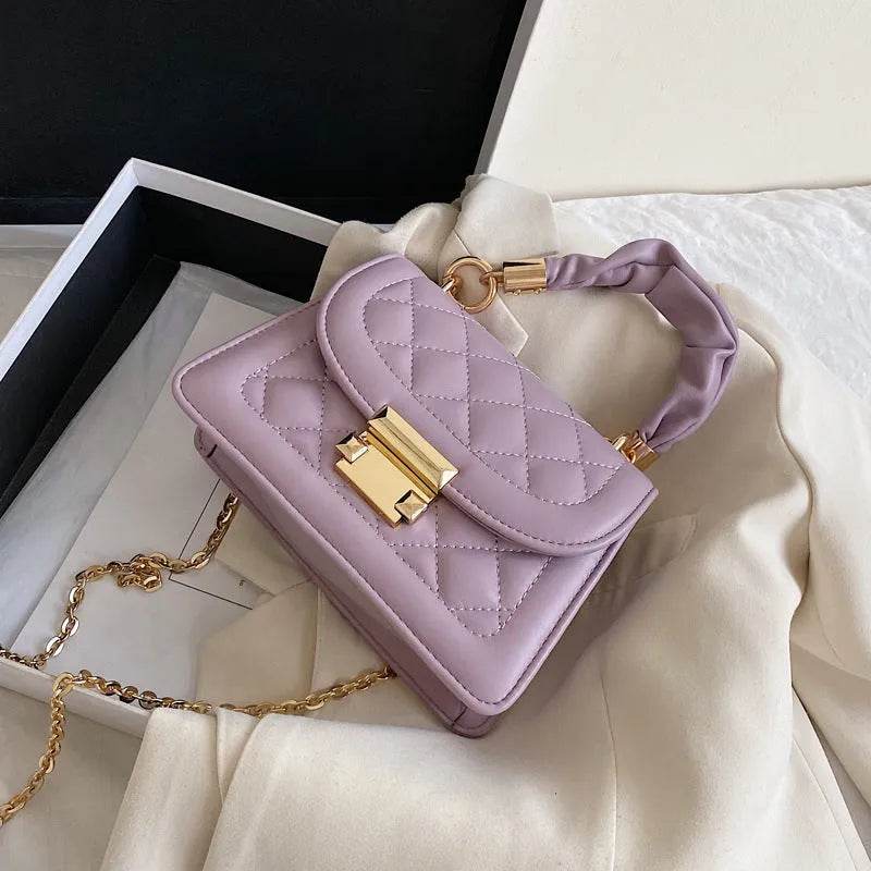 Women's Korean-style shoulder bag with rhombus pattern in purple colour showing crossbody wearing style