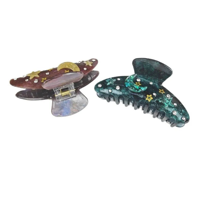 Oversized women's hair barrette with a starry sky pattern in sky blue.