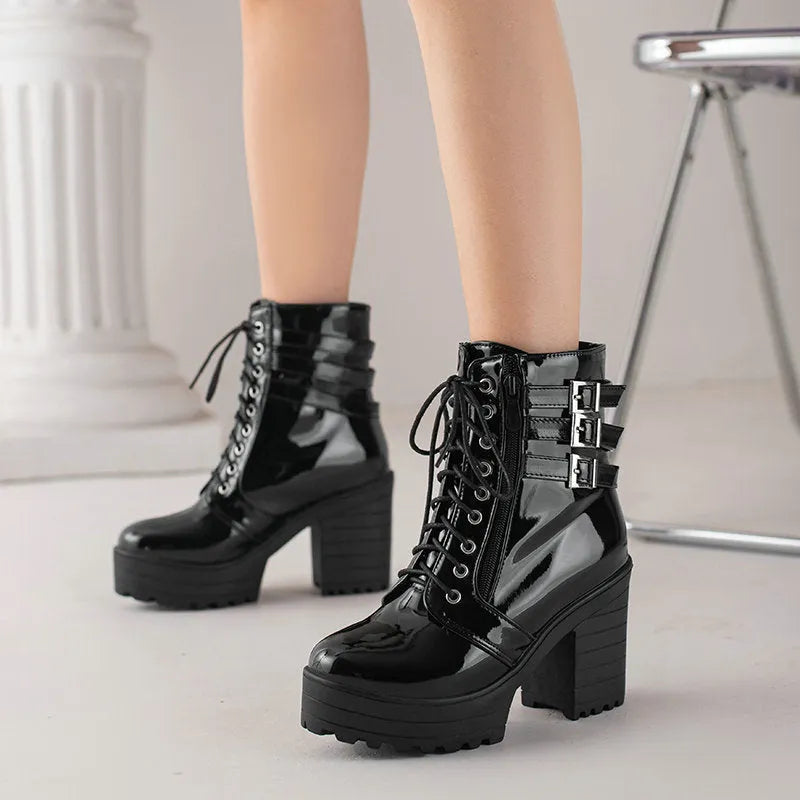 Women's black lace-up platform ankle boots with a round toe and a thick rubber sole.