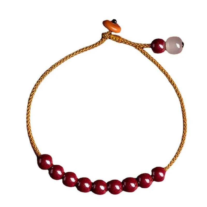 Cinnabar and Hetian jade bracelet with geometric beads on adjustable hand-woven cord