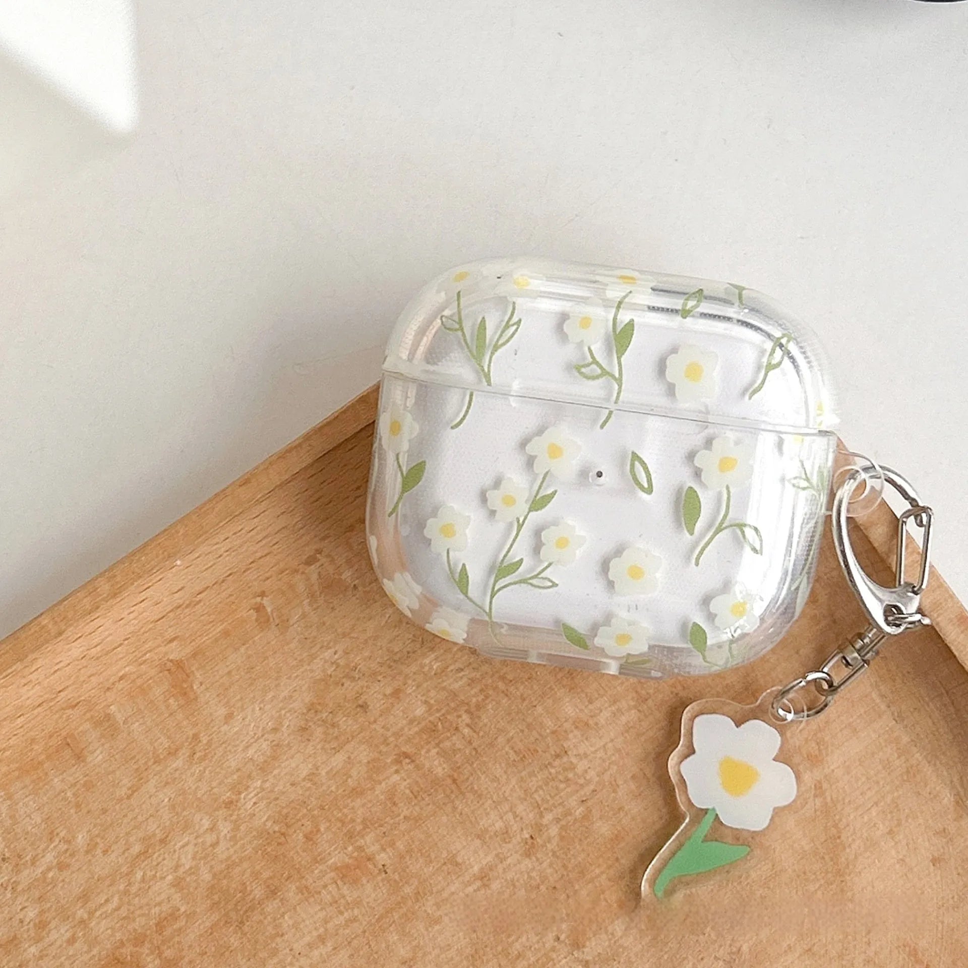 White floral transparent TPU protective case for Apple AirPods showing floral pattern details