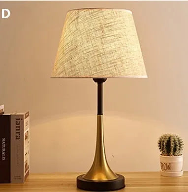 Retro alloy table lamp with dimmable LED lighting on wooden surface