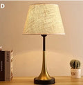Retro alloy table lamp with dimmable LED lighting on wooden surface