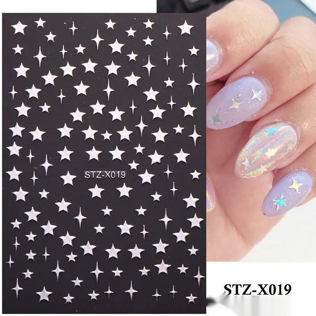 Pack of black and silver strip nail art stickers with cartoon and love pattern designs.