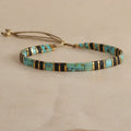 Geometric round glass bead bracelet in milky white, black, green, blue, or red.