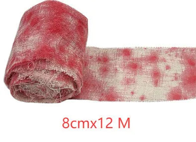 Roll of Halloween horror bandage in bloody red colour with a frayed end, showing its 8cm width and cloth-like polyester texture.
