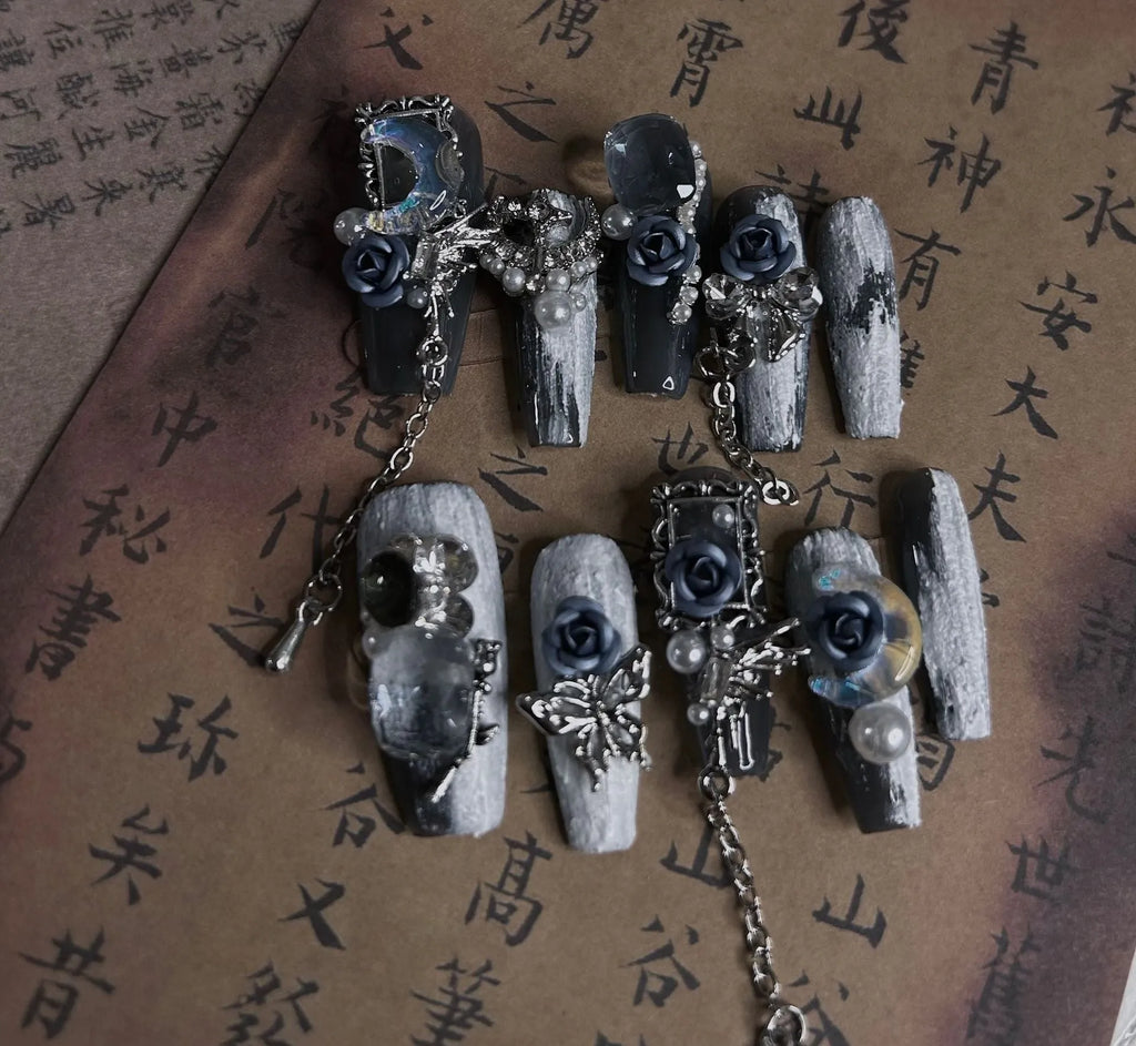 Heavy industry blue false nails with ornate rose and tulip pattern, shown in sizes XS S M L.