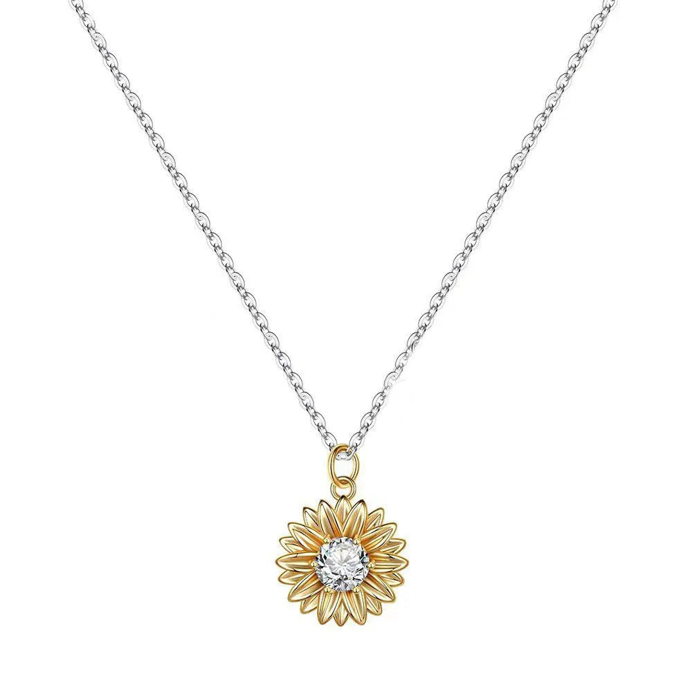 Close-up of a women's 925 silver necklace with a small daisy petal pendant on a cross chain, laid flat to show length.