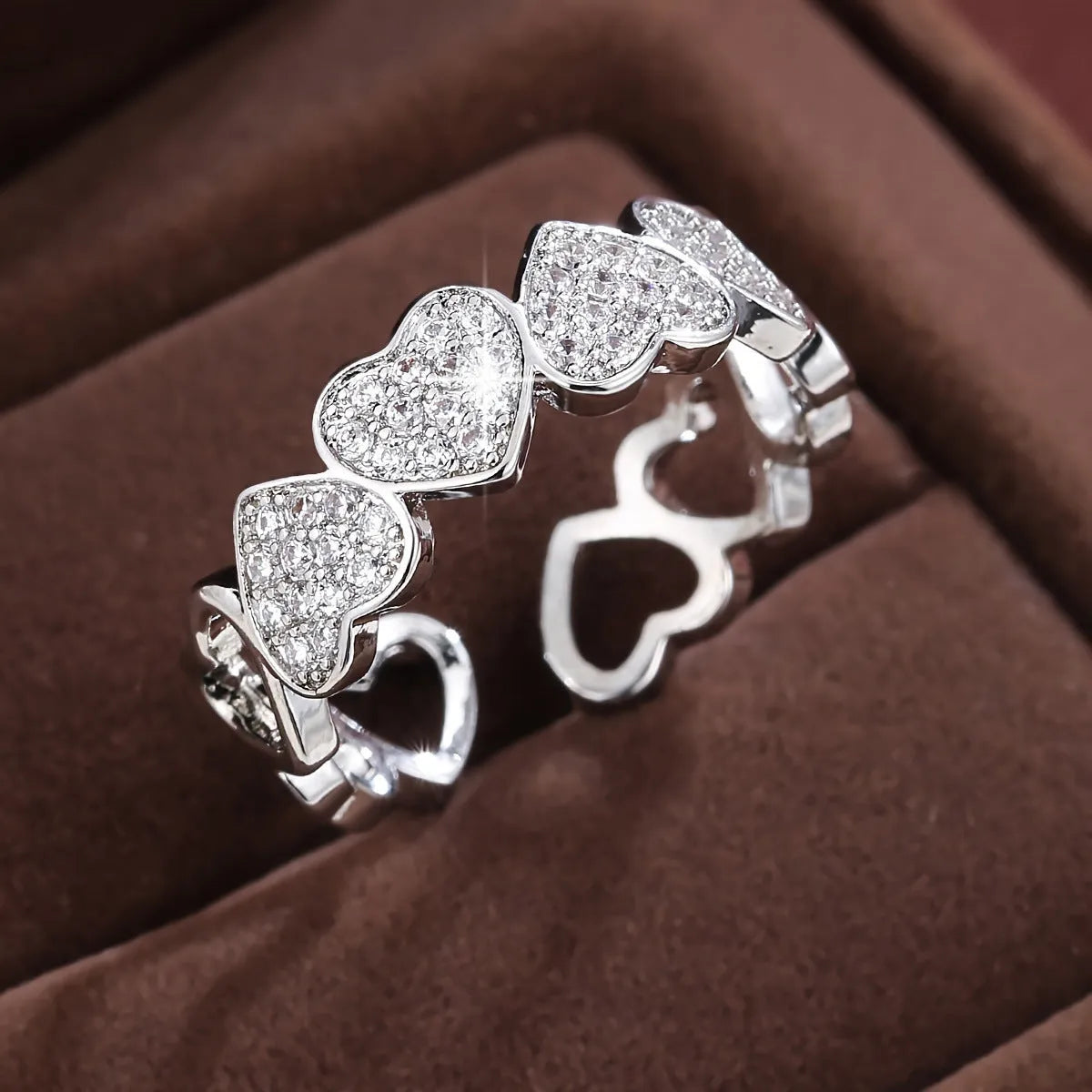 Adjustable geometric love heart couples ring in gold colour on small finger