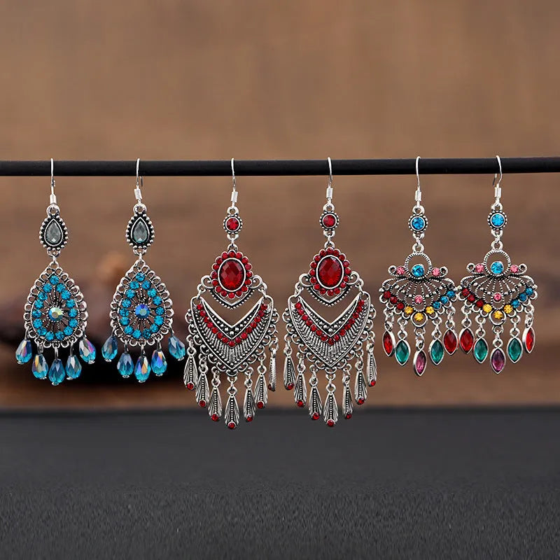 A pair of smart water drop purple retro long fringe drop earrings made from alloy metal.