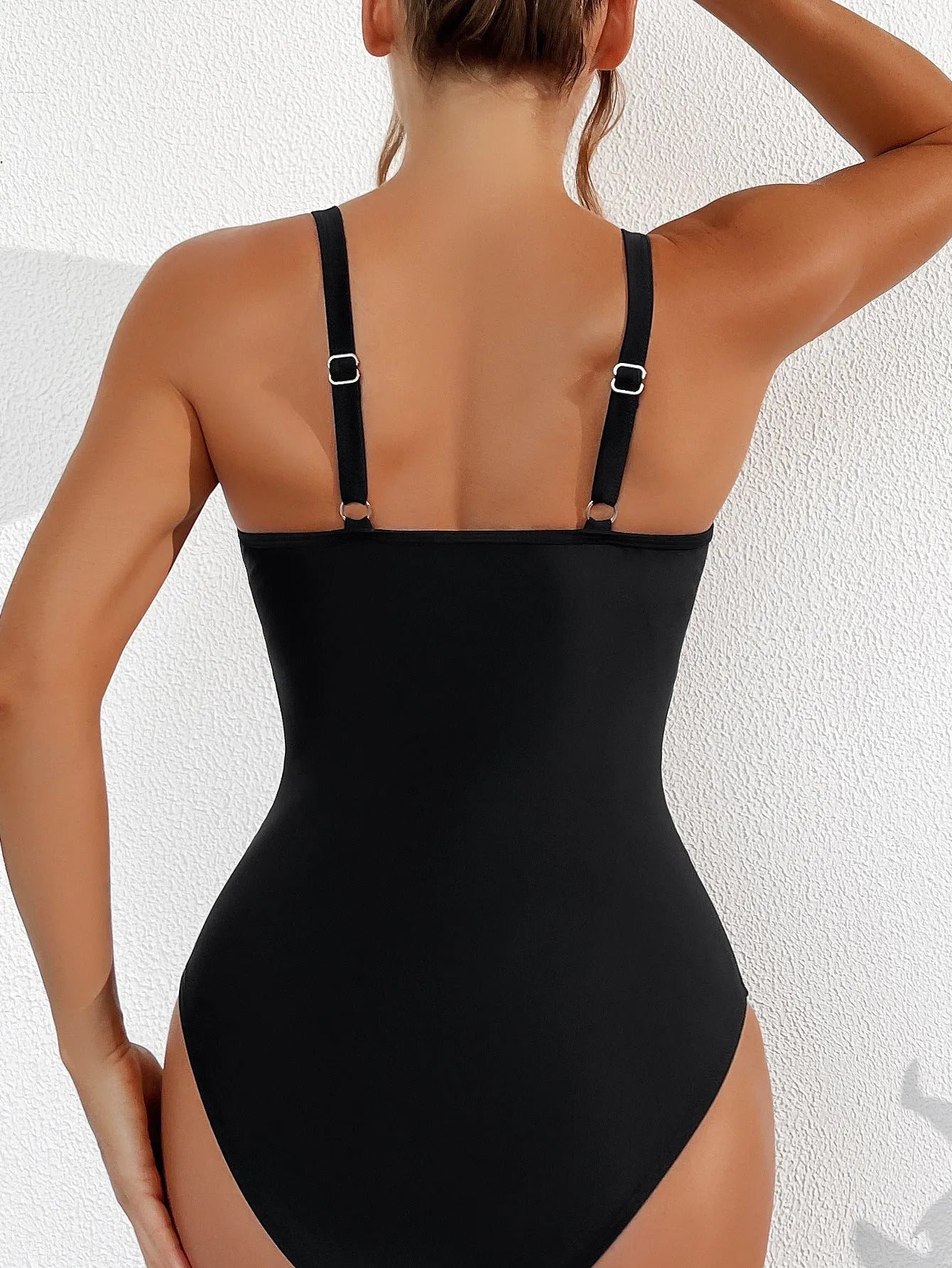 Black nylon mesh halter one-piece swimsuit with briefs bottom for women.