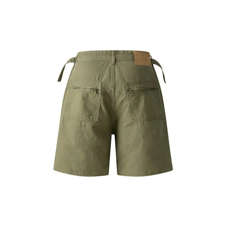 Retro grey washed cotton shorts with a zipper fly and loose fit on a mannequin.