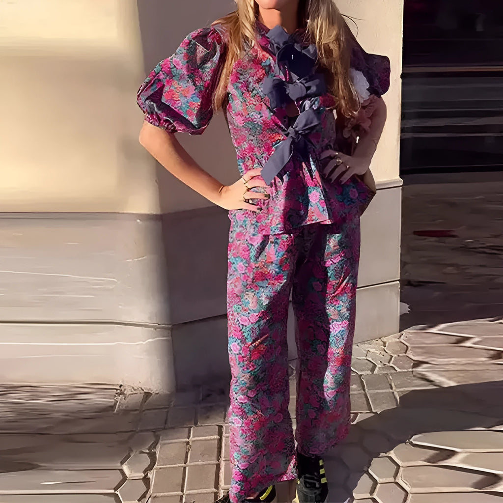 Women's floral print trouser suit set with tie-neck blouse and puff sleeves