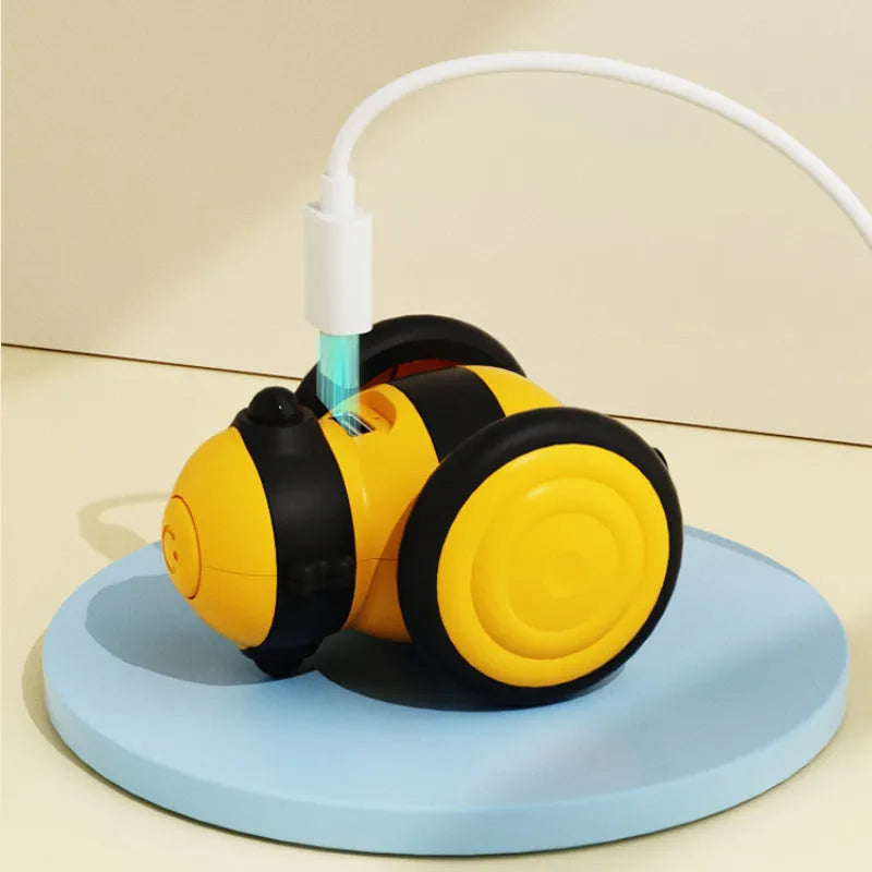 Electric bee-themed cat toy with feather attachments in pink or yellow colour options