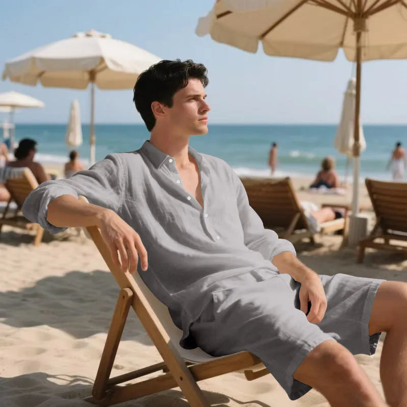 Linen long sleeve shirt and matching shorts beach set in light blue, laid flat.