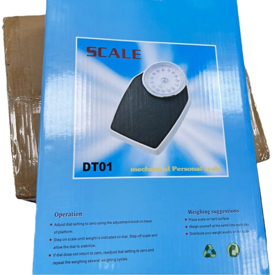 Black mechanical bathroom scale with large analogue dial showing weight measurements