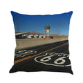 Linen cushion cover with US Route 66 scenic landscape print, shown in one of six available colours.