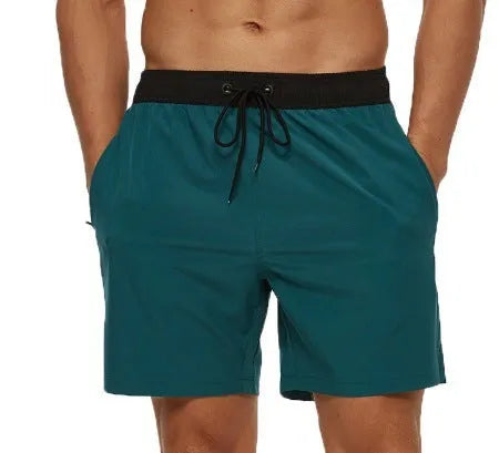 Men's blue athletic shorts with a stitching waistband, drawstring, and side headband pocket.