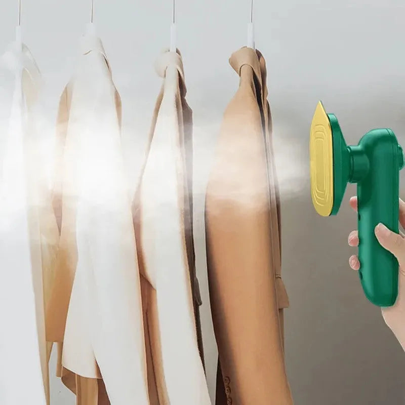 Dark green portable handheld hanging steam ironing machine with ceramic panel and power cord.