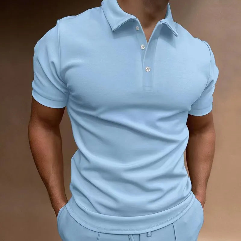 Men's grey cotton blend button t-shirt with short sleeves and a loose fit on a hanger.