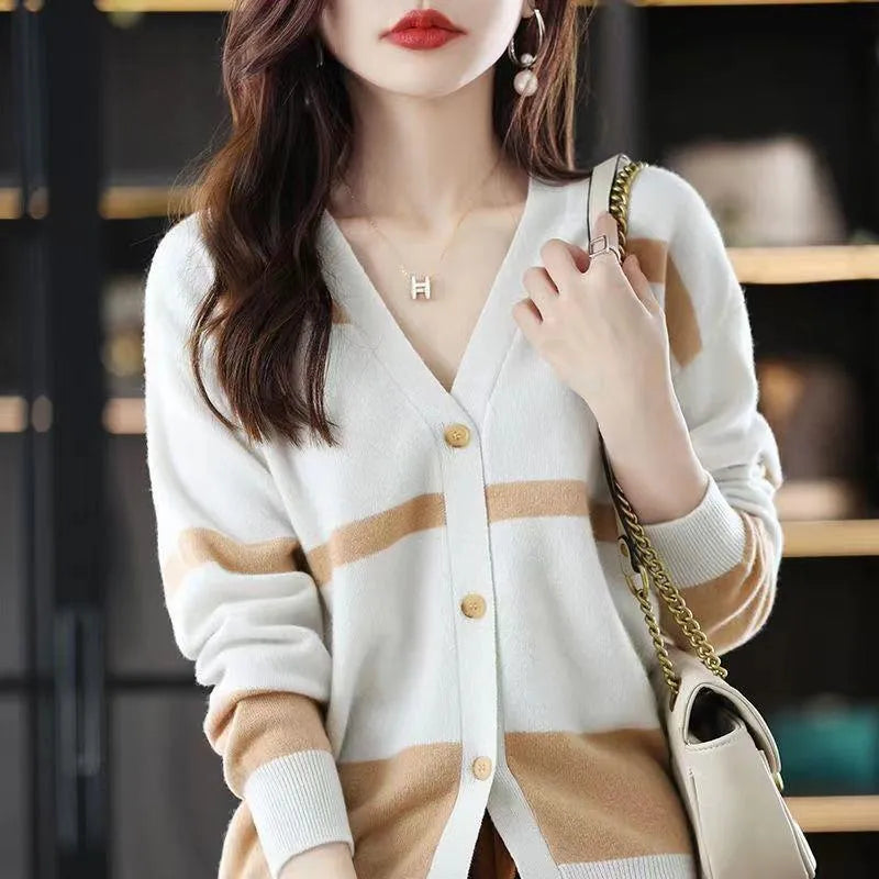 Women's striped V-neck knitted cardigan with 3D patterned sleeves and button front in a slim fit.