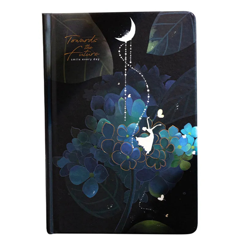 A5 scrapbook notebook with luminous cover open to show colour illustration pages, in purple colour option.