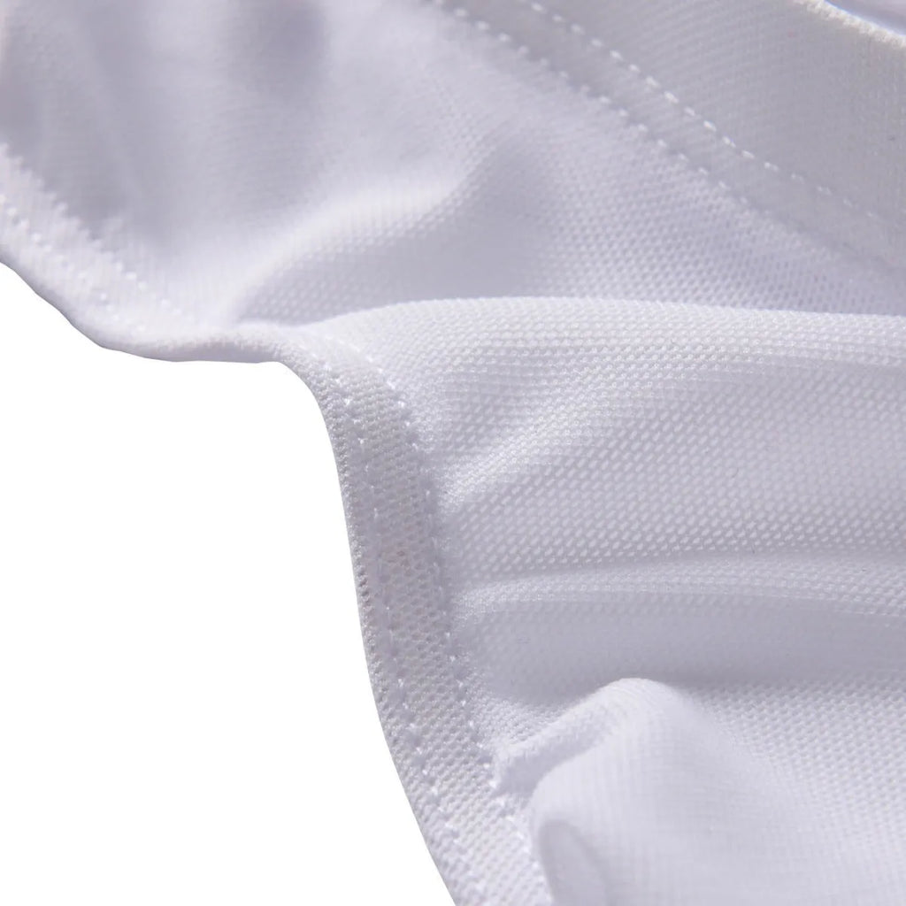 Men's black low-waist nylon briefs laid flat, showing triangle brief style and knitted fabric.
